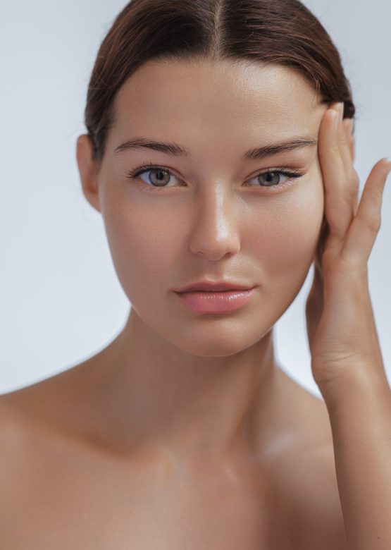 Anti Aging Treatment and Facelift Skin Care Concept. Woman with hand on cheek and eye